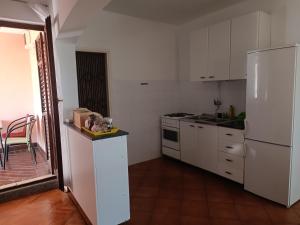 Kuchyň nebo kuchyňský kout v ubytování Rooms & Apartments Linda & Mario