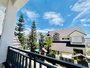 a view from the balcony of a house at NHỚ House Đà Lạt V in Da Lat