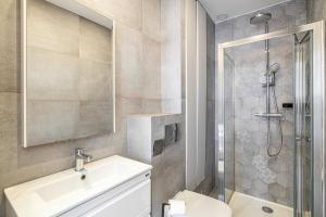 a bathroom with a shower and a sink and a toilet at Magnificent renovated 2 rooms apartment - 1BR3p in Cannes