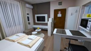 Postel nebo postele na pokoji v ubytování Apartmani Tomić