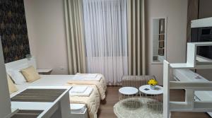 Postel nebo postele na pokoji v ubytování Apartmani Tomić