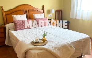 Łóżko lub łóżka w pokoju w obiekcie Apartamento Vacacional A Lanzada