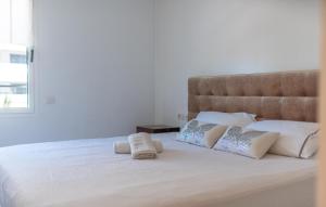 Кровать или кровати в номере Luxury Ibiza con piscina en Marina Botafoch
