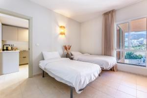 Ένα ή περισσότερα κρεβάτια σε δωμάτιο στο Reserva del Higueron 3 bedroom apartment Lola +32 φωτογραφίες