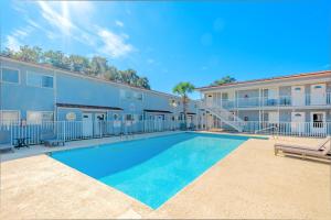a swimming pool in front of a building at Oak Shores 130 in Biloxi