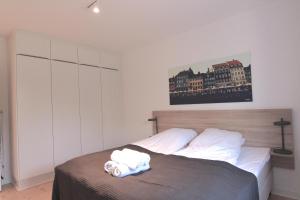 a bedroom with a bed with a towel on it at 2-BR apartment with a balcony in Charlottenlund - 194 in Charlottenlund