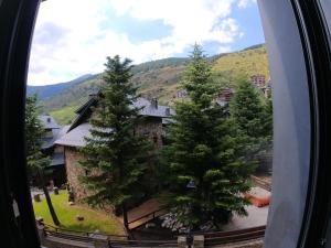 a view from a window of a building with trees at Soldeu Paradis La Solana in El Tarter