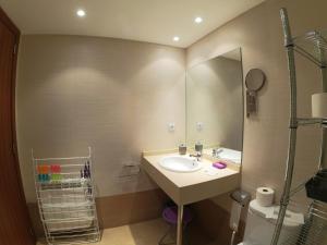 a bathroom with a sink and a mirror at Soldeu Paradis La Solana in El Tarter +18 photos