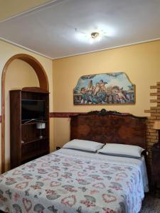 Säng eller sängar i ett rum på Casa Sanfaso'