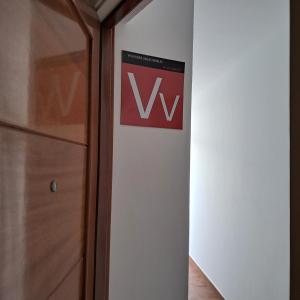 a sign on a wall next to a closet at Central Flat Puerto del Carmen in Puerto del Carmen