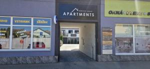 a group of windows on the side of a building at DomirexGroup Apartments in Lučenec
