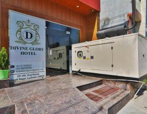 a sign for a diving quarry hotel sitting outside a building at Divine Glory Hotel in Lucknow