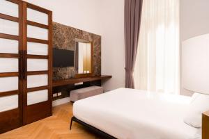 Posteľ alebo postele v izbe v ubytovaní limehome Lecce Palazzo BN