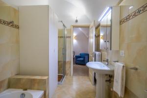 a bathroom with a sink and a shower and a toilet at Dimora EgiLò in Nardò