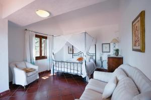 a living room with a crib in a bedroom at Villa Azzurra , piscina, parcheggio e vista mare in Porto Istana