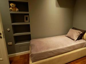 Postel nebo postele na pokoji v ubytování Ema Apartment Tirana