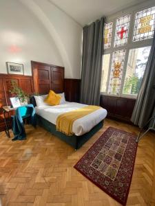 a bedroom with a bed and a large window at Endsleigh Park in Hull