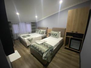 Postel nebo postele na pokoji v ubytování Sirkeci Esen Apart