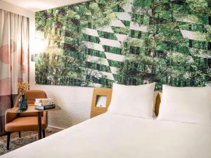 Giường trong phòng chung tại Novotel Bordeaux Mérignac