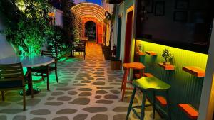a restaurant with a table and chairs in a room at Lotus City Sığacık in Seferihisar +27 photos