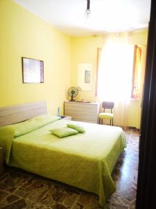 Un ou plusieurs lits dans un hébergement de l'établissement vacanze al Mare appartamento in villa