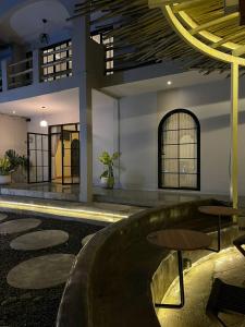 a building with a pool in the middle of a room at Sora Boutique Stay in Ciwidey