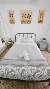 a bedroom with a bed with two towels on it at Central and Basic Drassanes HOSTEL in Barcelona
