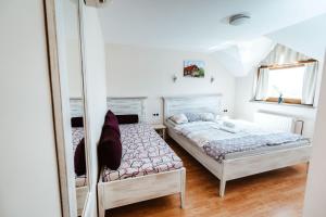 Postel nebo postele na pokoji v ubytování Zelena Oaza - B&B