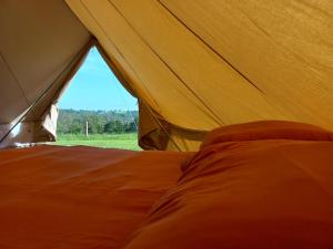 Postel nebo postele na pokoji v ubytování Tipi du petit villers