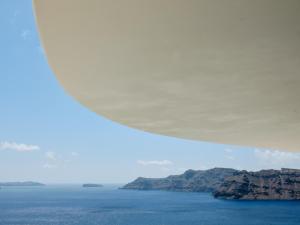 a view of the ocean from under a plane at Andronis Boutique Hotel in Oia