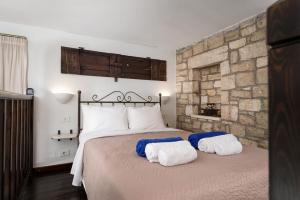 Posteľ alebo postele v izbe v ubytovaní Orelia Cretan Deluxe Apartments