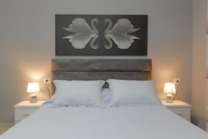 A bed or beds in a room at Seaview Bunec