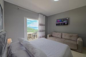 A bed or beds in a room at Seaview Bunec