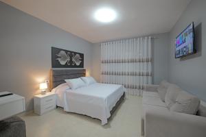 A bed or beds in a room at Seaview Bunec