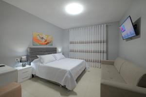 A bed or beds in a room at Seaview Bunec