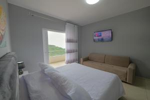 A bed or beds in a room at Seaview Bunec