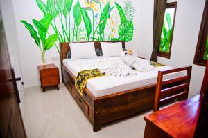 Ένα ή περισσότερα κρεβάτια σε δωμάτιο στο Tuti House Gili Trawangan +66 φωτογραφίες