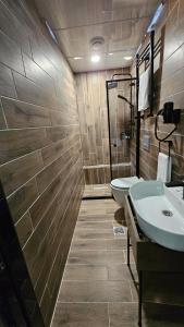 a bathroom with two sinks and a toilet and a shower at Rever Hotel in Urfa