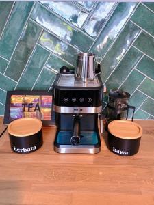 a coffee maker sitting on top of a counter at Apartament EM in Krosno