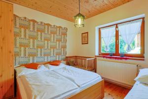 Posteľ alebo postele v izbe v ubytovaní Apartmány Anička ubytovanie region Liptovský Mikuláš