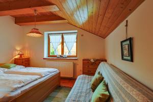 Posteľ alebo postele v izbe v ubytovaní Apartmány Anička ubytovanie region Liptovský Mikuláš