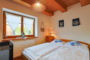 Posteľ alebo postele v izbe v ubytovaní Apartmány Anička ubytovanie region Liptovský Mikuláš + 37 fotografií