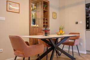 a dining room with a table and chairs at Jupiter Luxury Accommodation in Split
