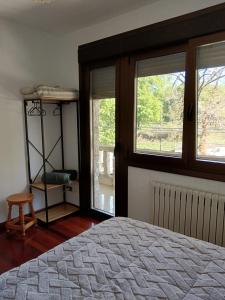 Ένα ή περισσότερα κρεβάτια σε δωμάτιο στο Casa Ruliña