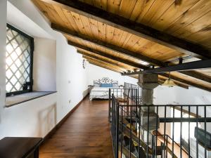 a hallway with a wooden ceiling and a couch at Villa Idyllica in Gaggi +27 photos