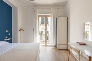 Posteľ alebo postele v izbe v ubytovaní Sant'Agostino Apartment with Terrace by Wonderful Italy + 10 fotografií