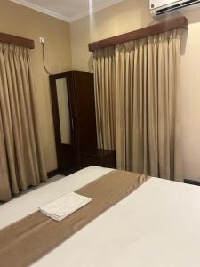 Postel nebo postele na pokoji v ubytování MercuryFM 101 Yarl Mercury Inn - Jaffna