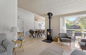 a living room with a wood burning stove in it at Stunning Home In Gilleleje With Sauna in Gilleleje