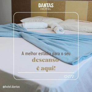 Postel nebo postele na pokoji v ubytování Dantas Hotel