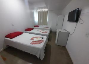 Postel nebo postele na pokoji v ubytování Dantas Hotel